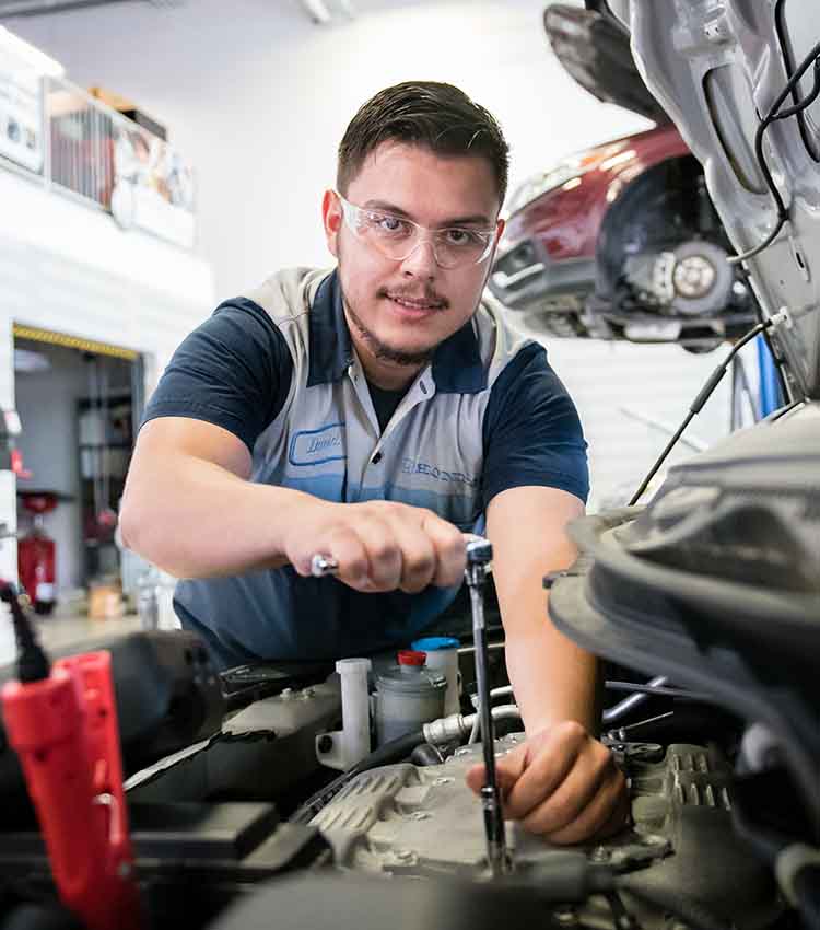 honda pact student, daniel working on battery of a honda car