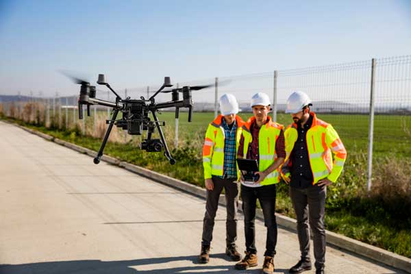 field workers with drone camera