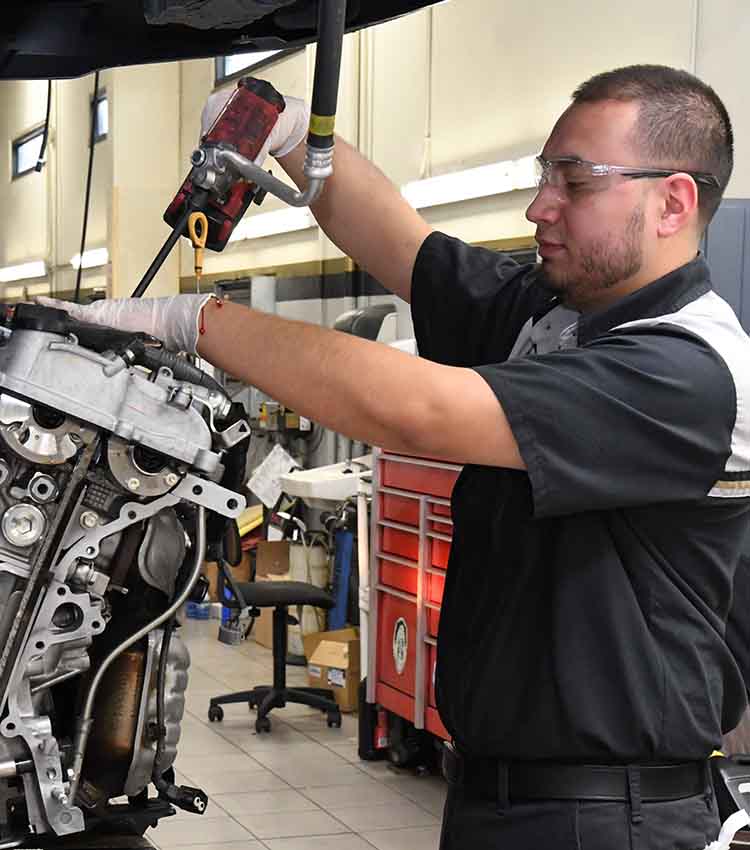 toyota tten student working on car